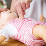 Infant CPR two finger cvompression